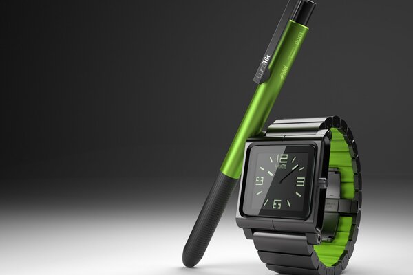 Reloj negro y bolígrafo con inserto verde