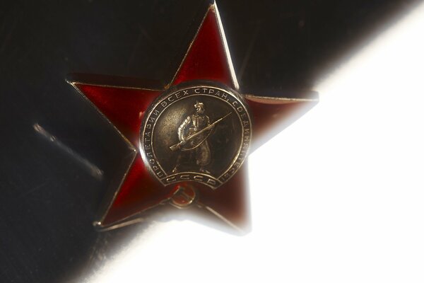 Metal star with the image of a warrior