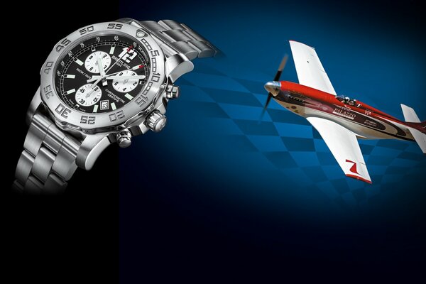 L horloge et l avion. Montre en argent