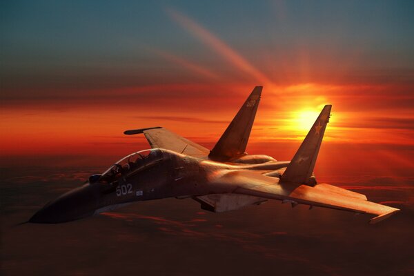 A single Russian Su-30 fighter jet on the background of sunset