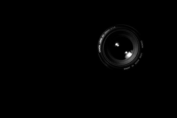 Camera lens kenon on a black background