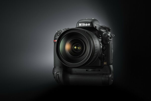 Nikon camera with an open lens on a black background