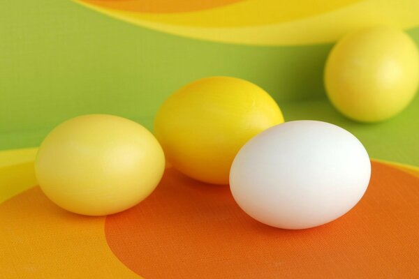 Eggs are yellow and white on a yellow background