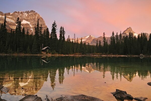 Sunset by the lake in the mountains