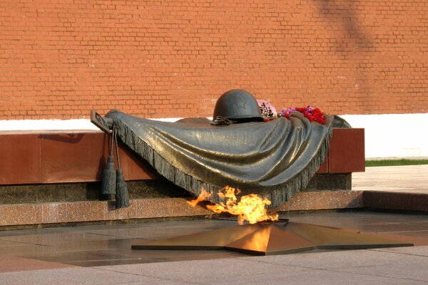 Eternal flame and a bronze monument in memory of the soldiers who fell in the Second World War