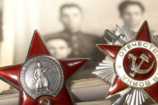 Awards of the Great Patriotic War on the background of an old photo