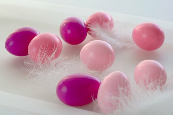 Pink and lilac Easter eggs among the fluff