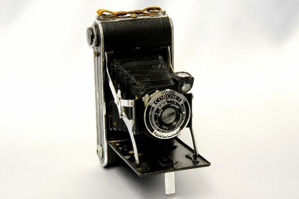 A rare folding camera on a white background