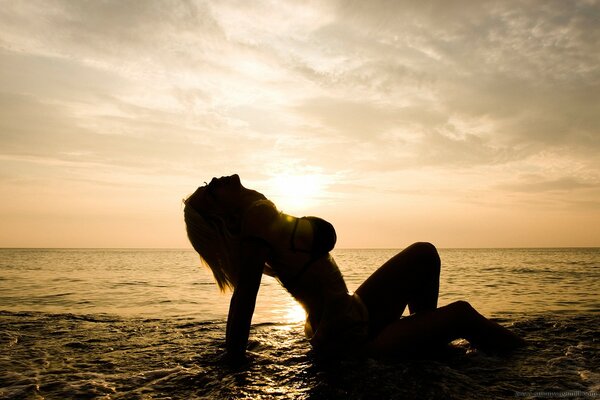 Susan Wayland on the beach at sunset