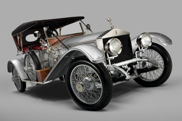 An old classic car on a gray background