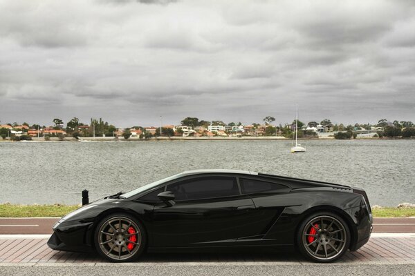 Beautiful black car on the background of the sea