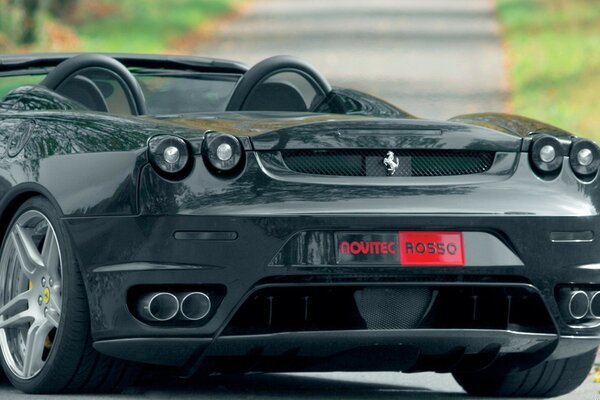 Black Ferrari in the autumn park