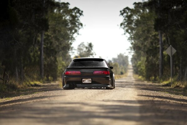 Nissan silva sports car rushes through the forest