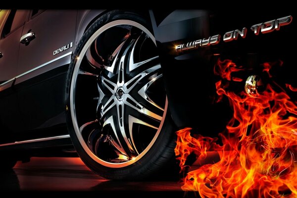 Fire from under the wheels of a black car