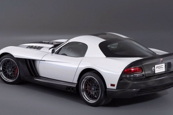 Black and white sports car on a gray background