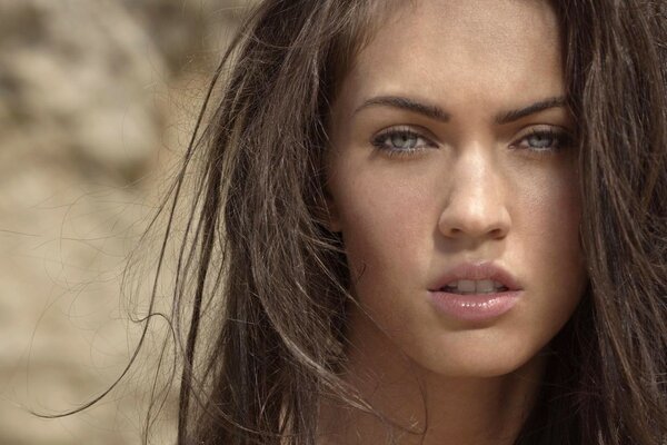 Portrait of Megan Fox on a desert background