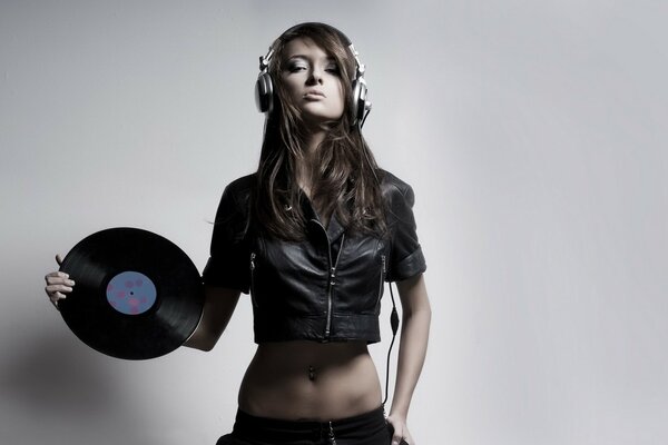 DJ girl with vinyl in hand