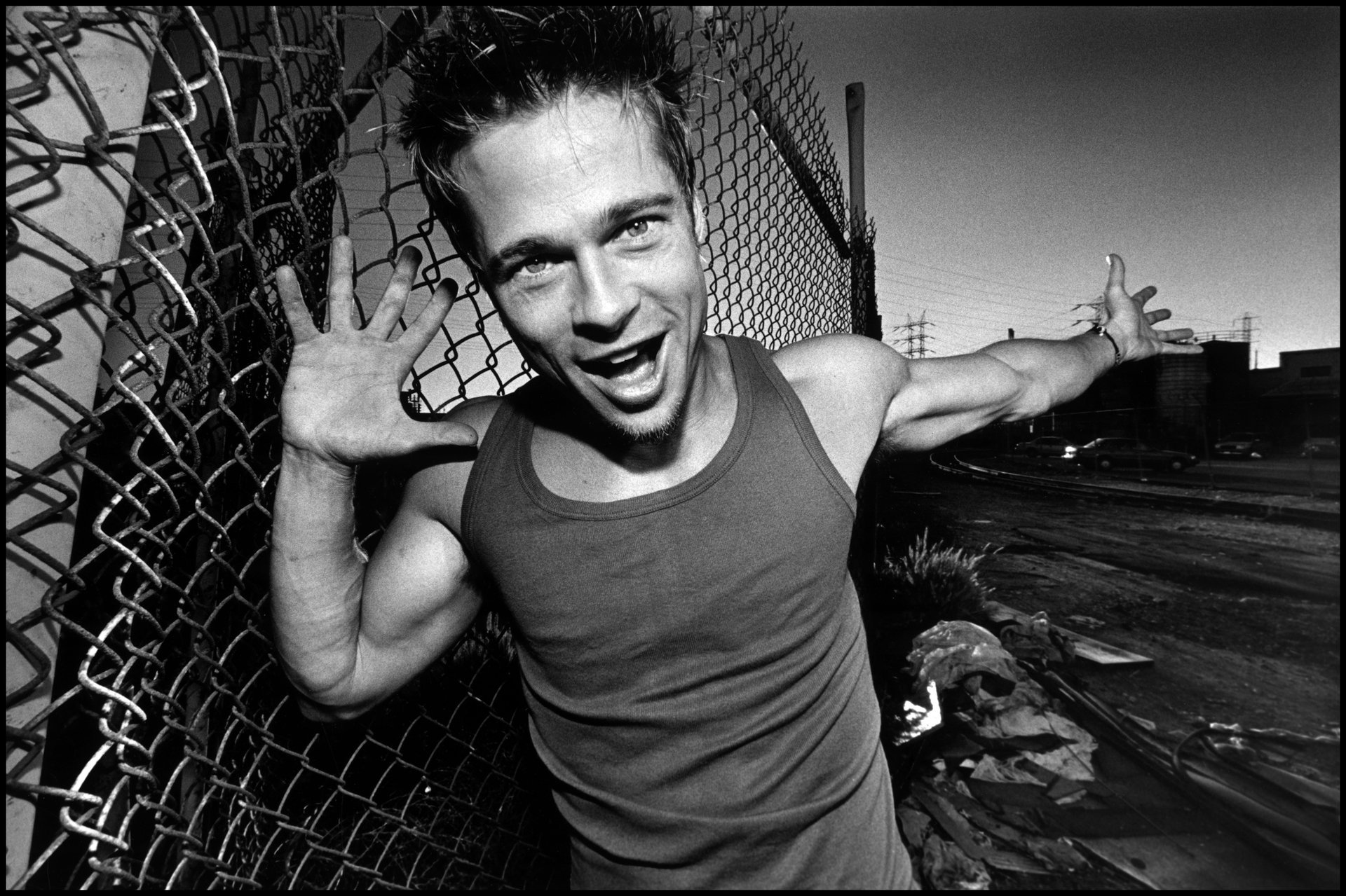 brad pitt grid emotions greyness guy celebrity brad pitt gray t-shirt b-w chain link fence palm hands eyes face black and white