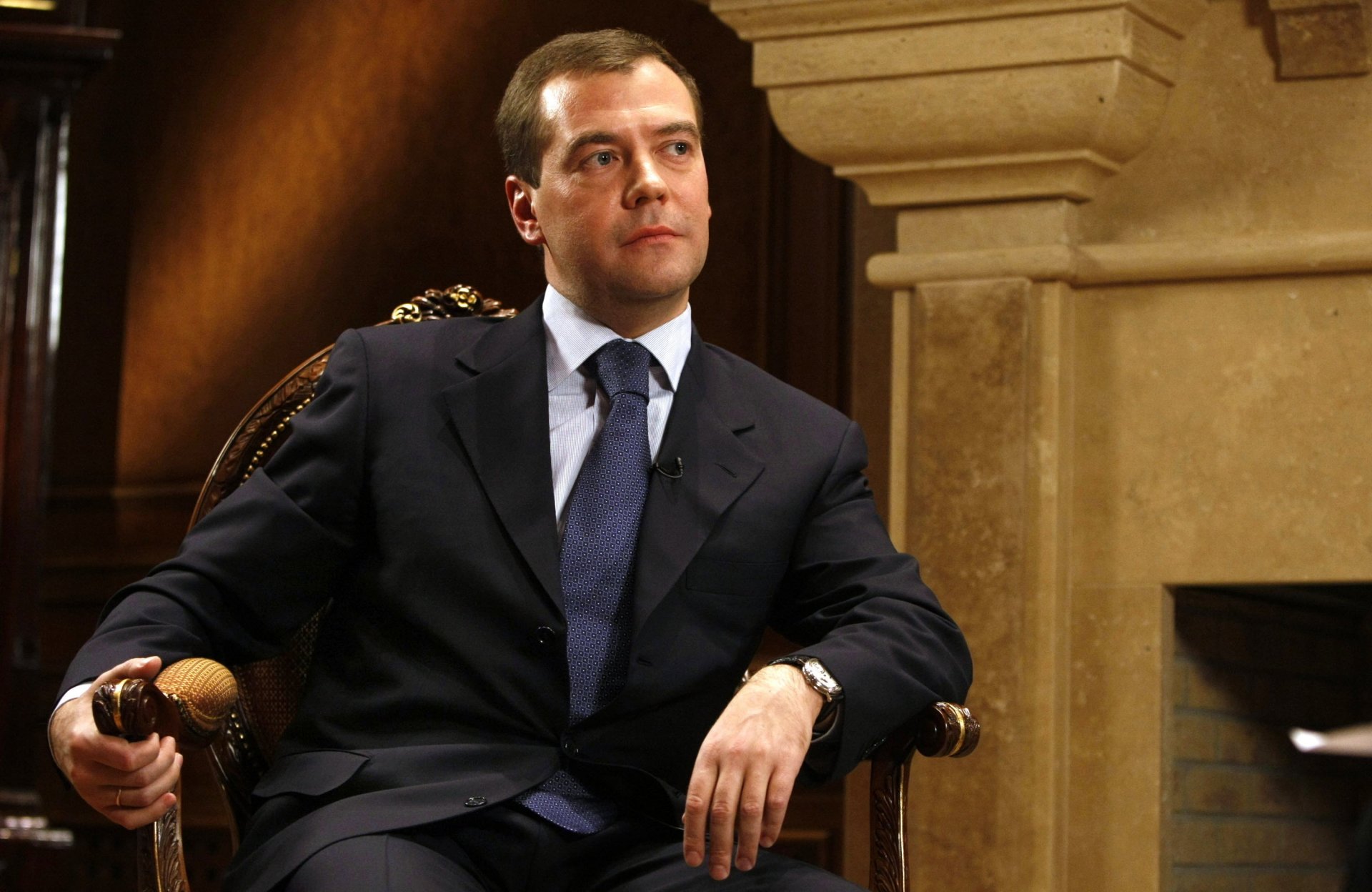 itting in the chair president biggie look policy portrait russia medvedev dmitry medvedev tie costume reverie looking off to the side watch room interior eyes face