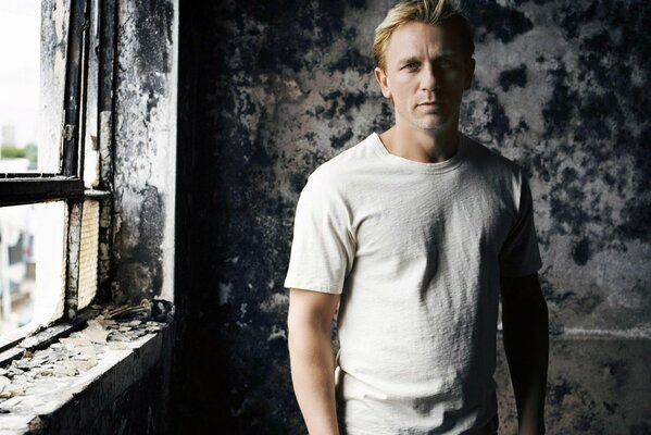 A famous blonde actor in an abandoned house