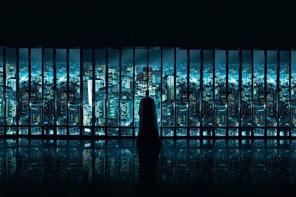 Batman from the back against the background of the night city