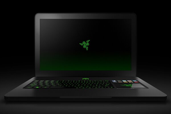 Black open laptop on black background