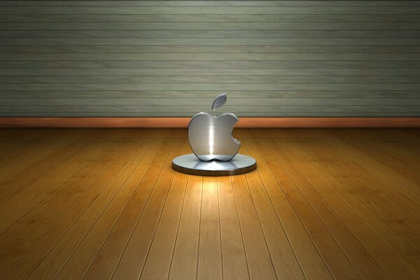 Metalowe logo Apple na drewnianej powłoce