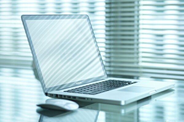 A bright workplace with a laptop on the table