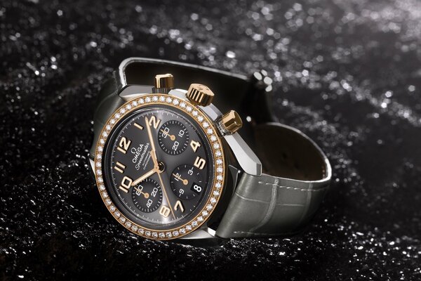 Stylish watch with gold in a black strap