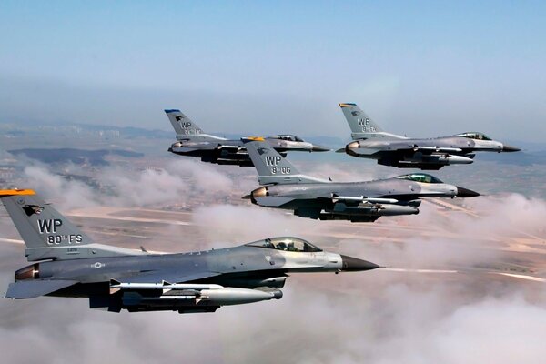 Military F-16 fighter jets fly in the sky