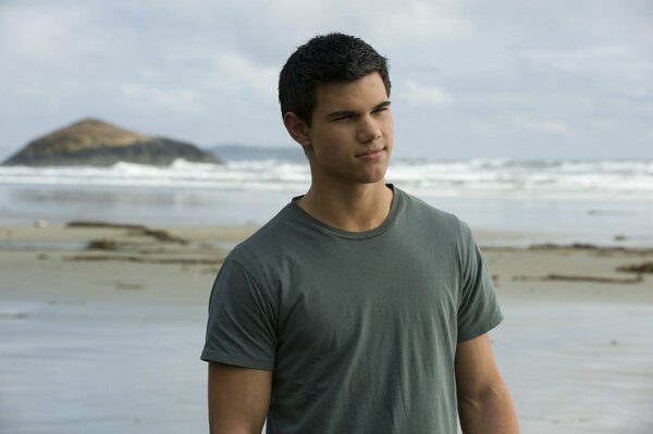 Jacob Black in a T-shirt on the coast