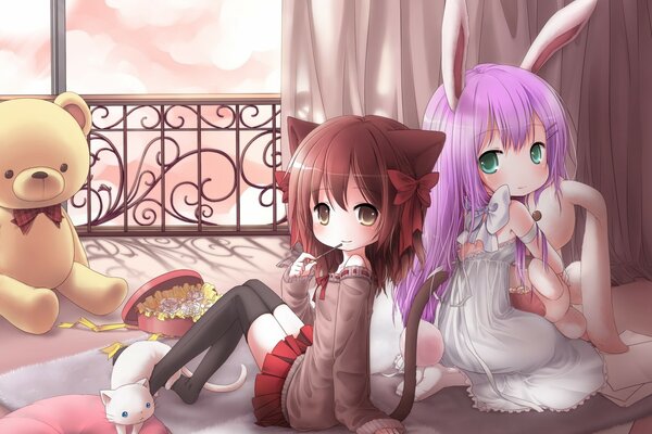 A kitten girl and a bunny girl with a teddy bear