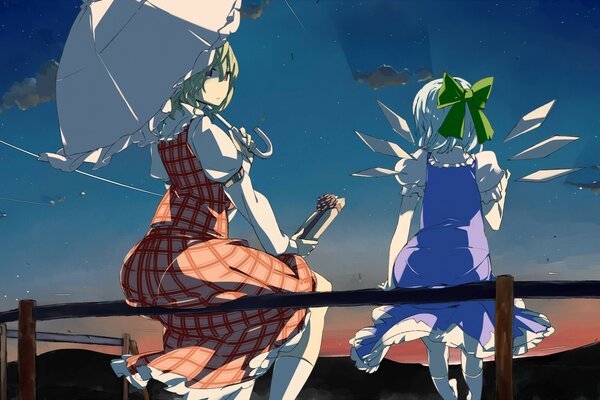 Dos chicas de anime con paraguas