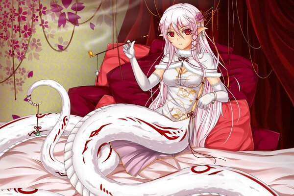 A girl with a snake tail in white on a bed with gloves