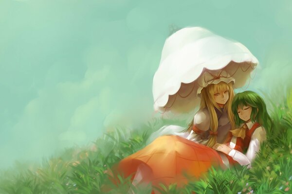 Two girls are lying on the grass under an umbrella