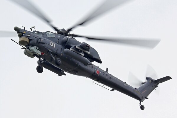 Black Mi-28 helicopter in flight