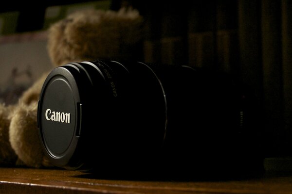 Macro photography of a Canon camera On the background of a teddy bear