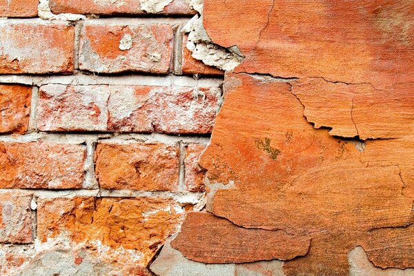 Brick wall with plaster and crack texture