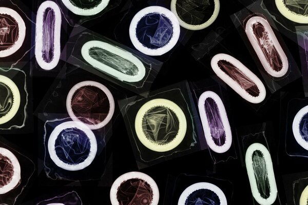 Colored condoms of different shapes