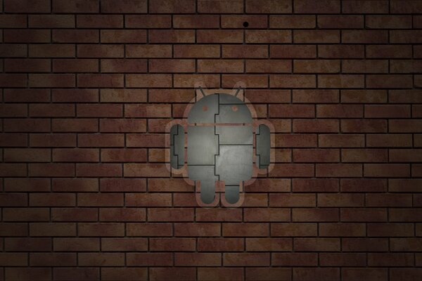 Значок андроида на кирпичной стене