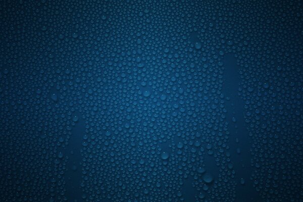 Gouttes d eau sur la surface bleue