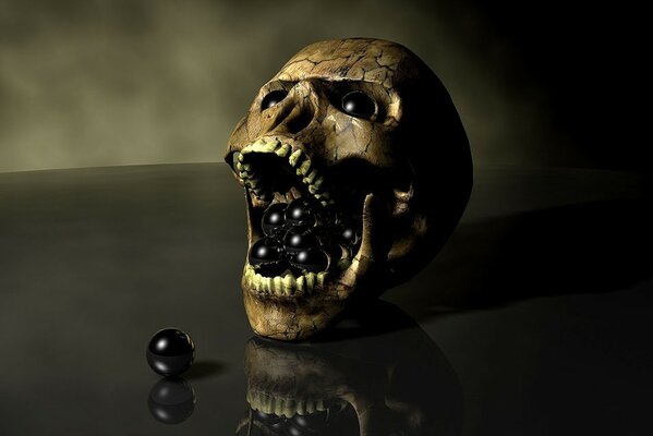 Crâne avec des boules noires sur une table noire