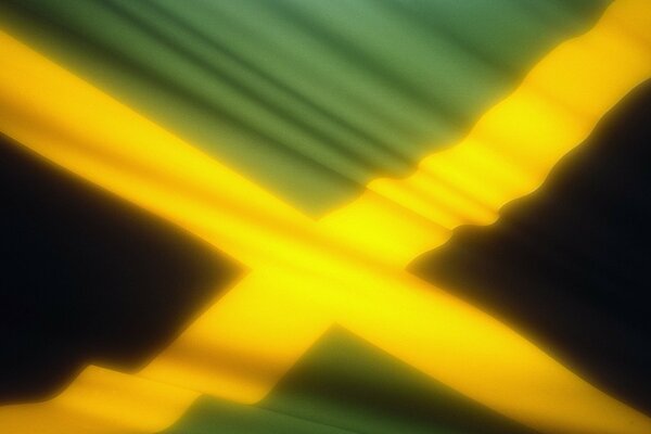 Immagine della Bandiera Gialla e verde della Giamaica che si sviluppa nel vento