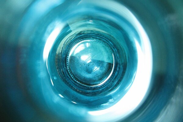 The bottom of the blue bottle