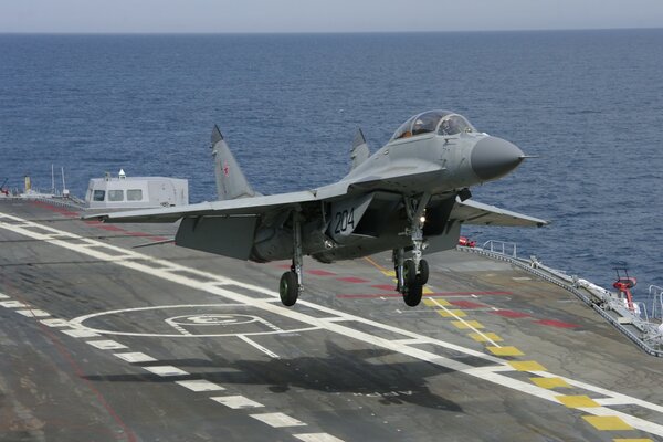 The mig-29 kub aircraft carrier comes in to land on the liner s platform