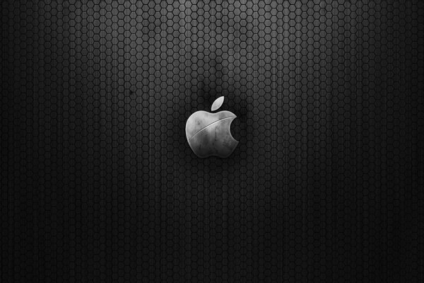 Signo de apple sobre fondo negro en forma de panal