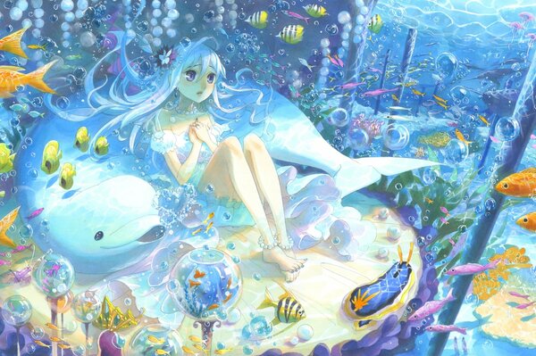 A girl is sitting underwater with fish