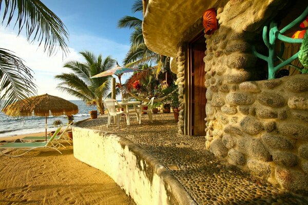 Stone house on the sandy shore