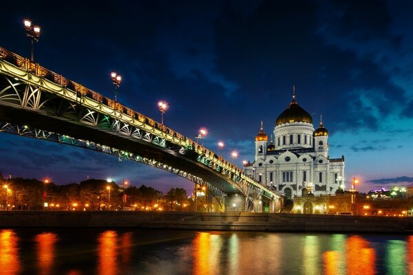 Night temple in lights on the river