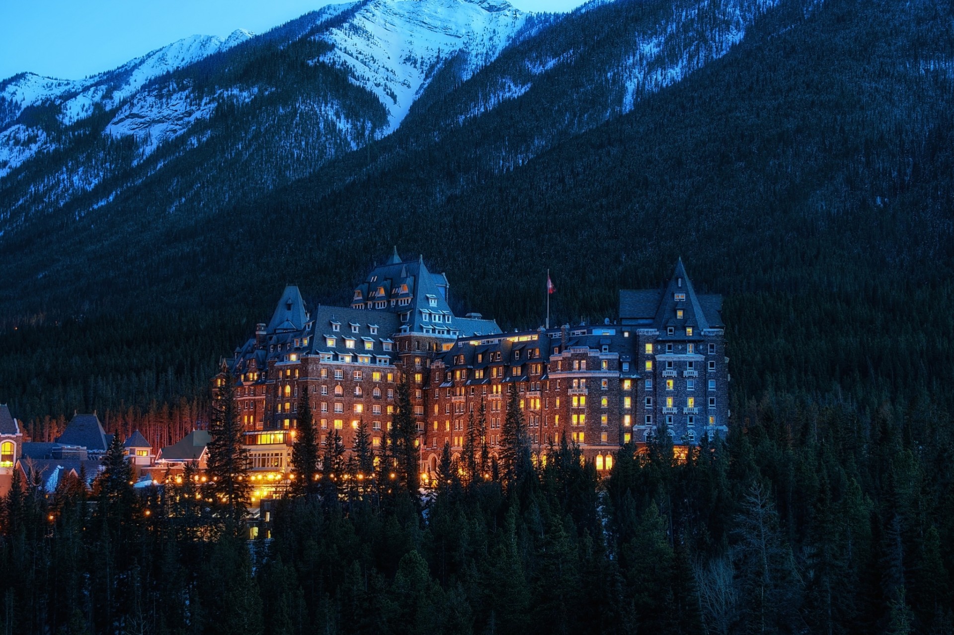 night alberta national park light canada banff national park banff building city mountains lighting trees hotel